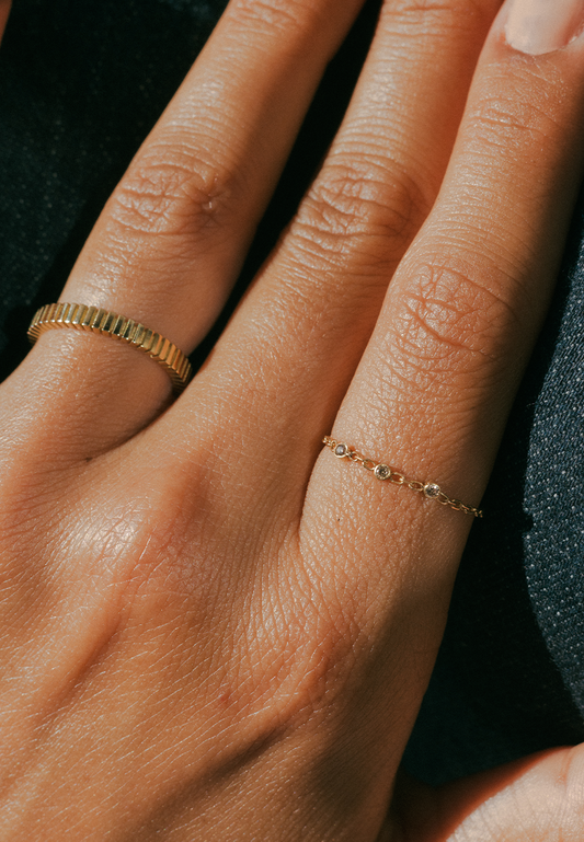 Chapter V — Motion Chain Ring with three Round Brown Diamonds